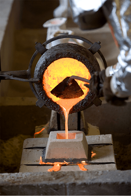 Molten metal poured into a casting mould